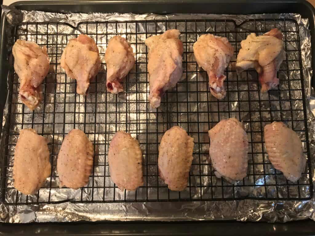seasoned chicken wings on baking rack