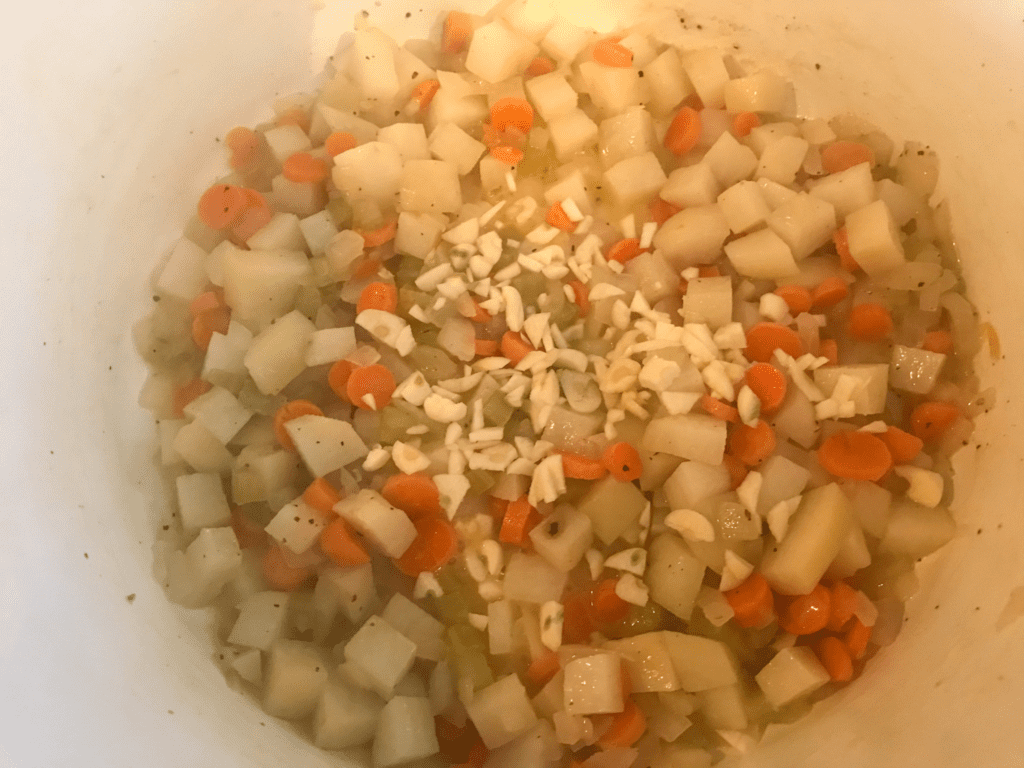 Garlic and Chardonnay in pot of veggies