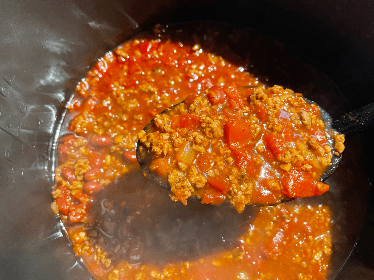 Spoon full of chili from pressure cooker
