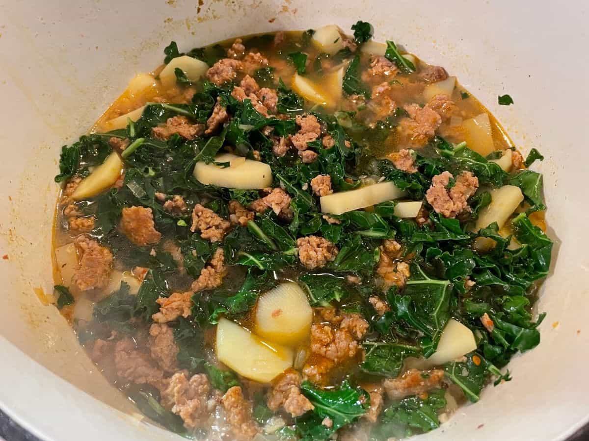 stirred soup with sausage and kale added