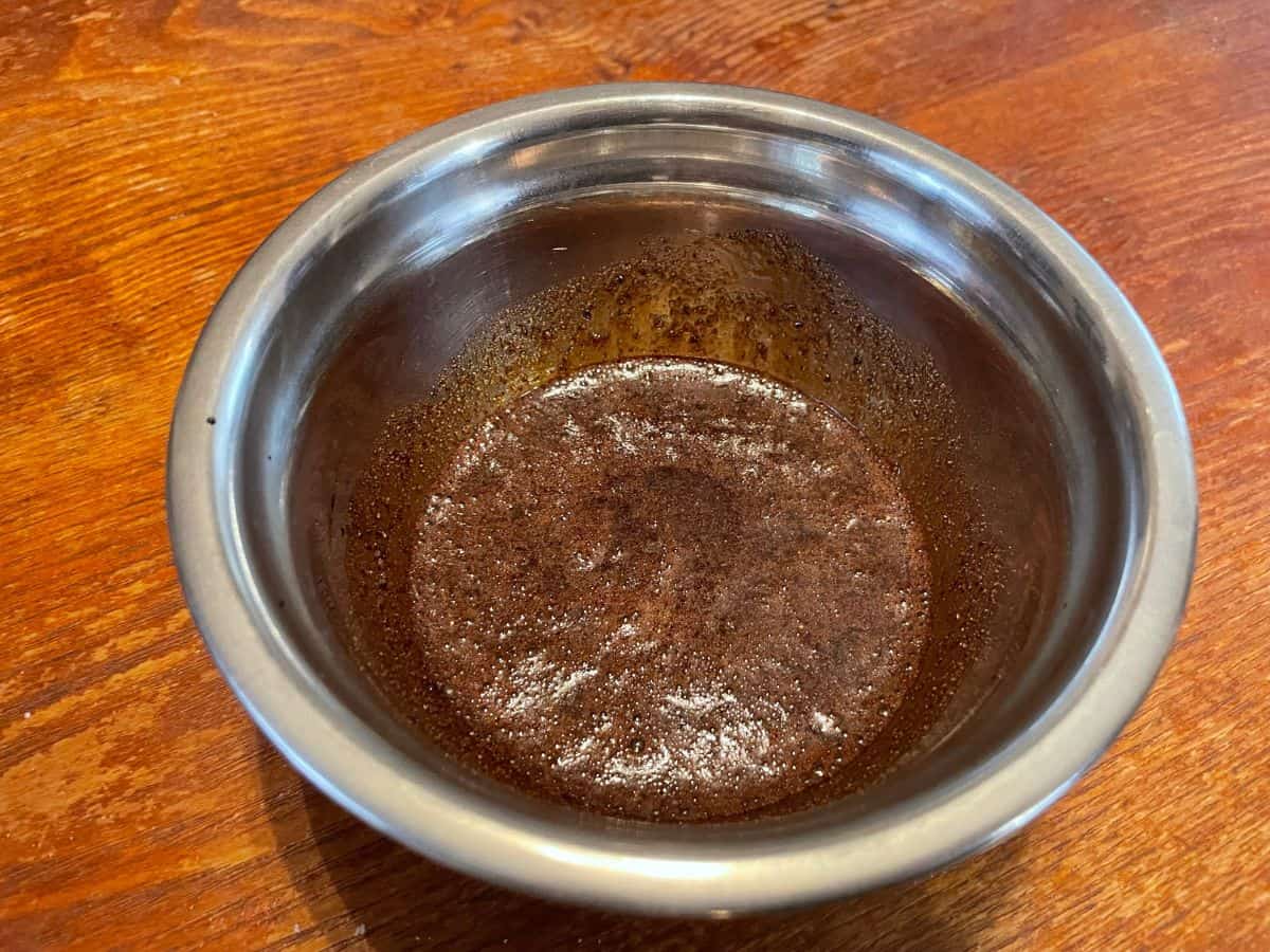 oxtail seasoning/ marinade mixed in a silver mixing bowl