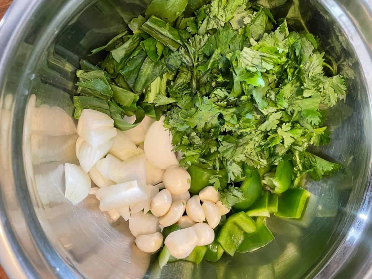 chopped up herbs and vegetables to blend for sofrito