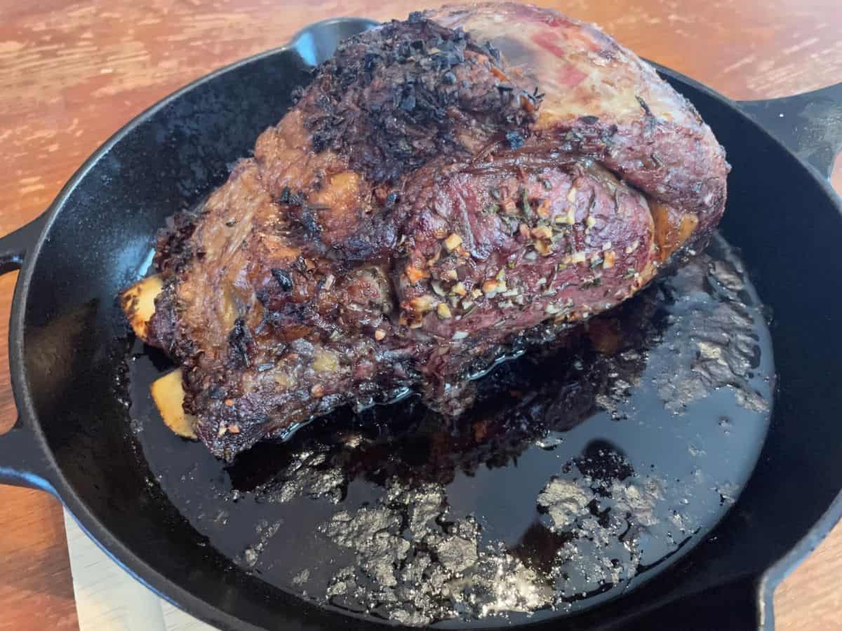 cooked prime rib in cast iron skillet