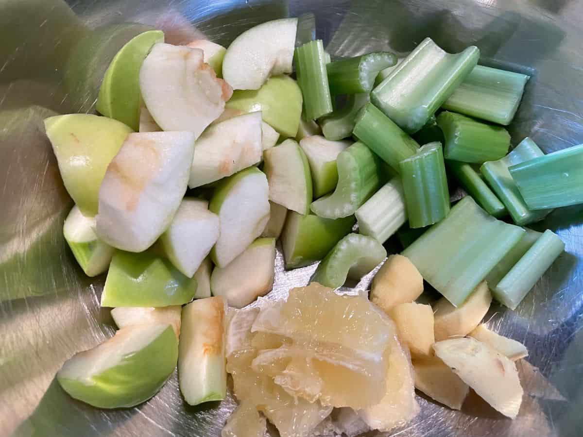 chopped apples, celery, lemon, and ginger in a large mixing bowl