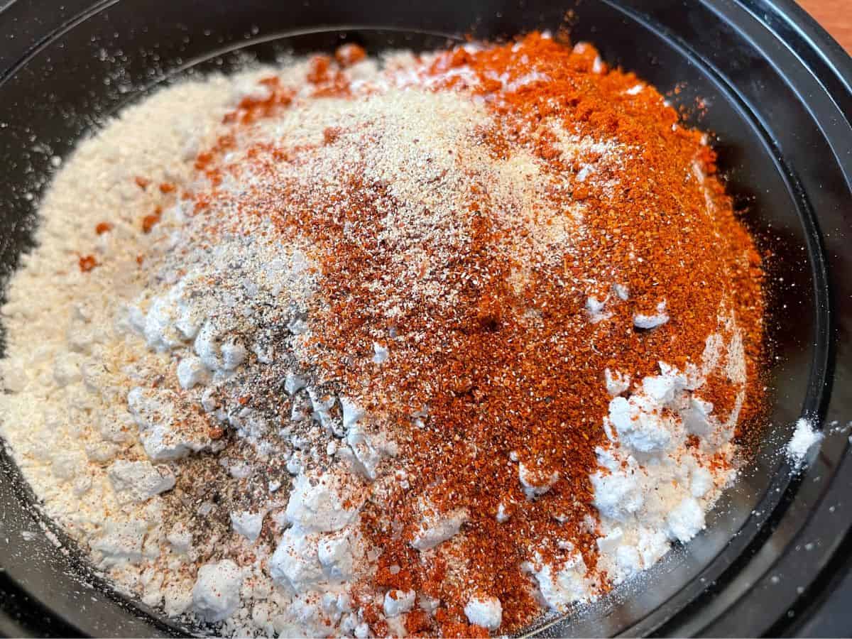 dry mix ingredients in a black bowl unmixed