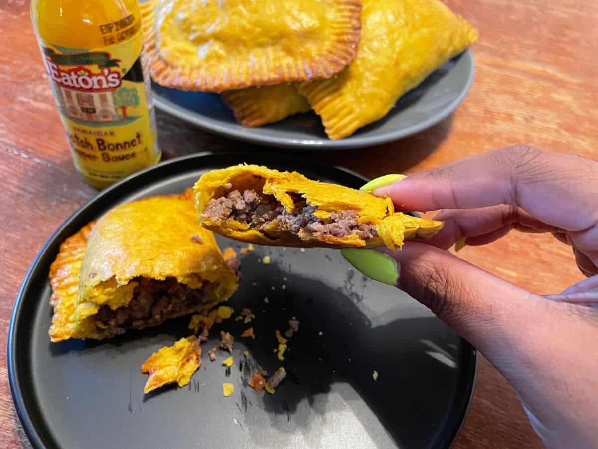cooked beef patty cut in half to show filling