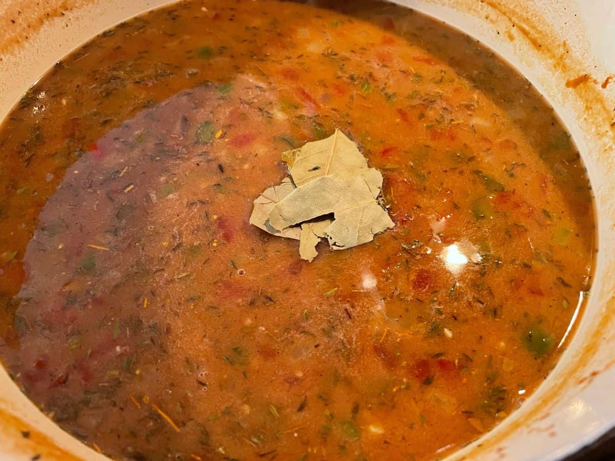 stock and seasonings added to dutch oven to simmer for gumbo