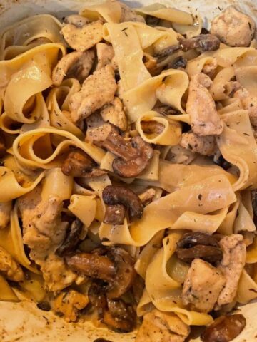 close up of chicken Marsala pasta in a dutch oven