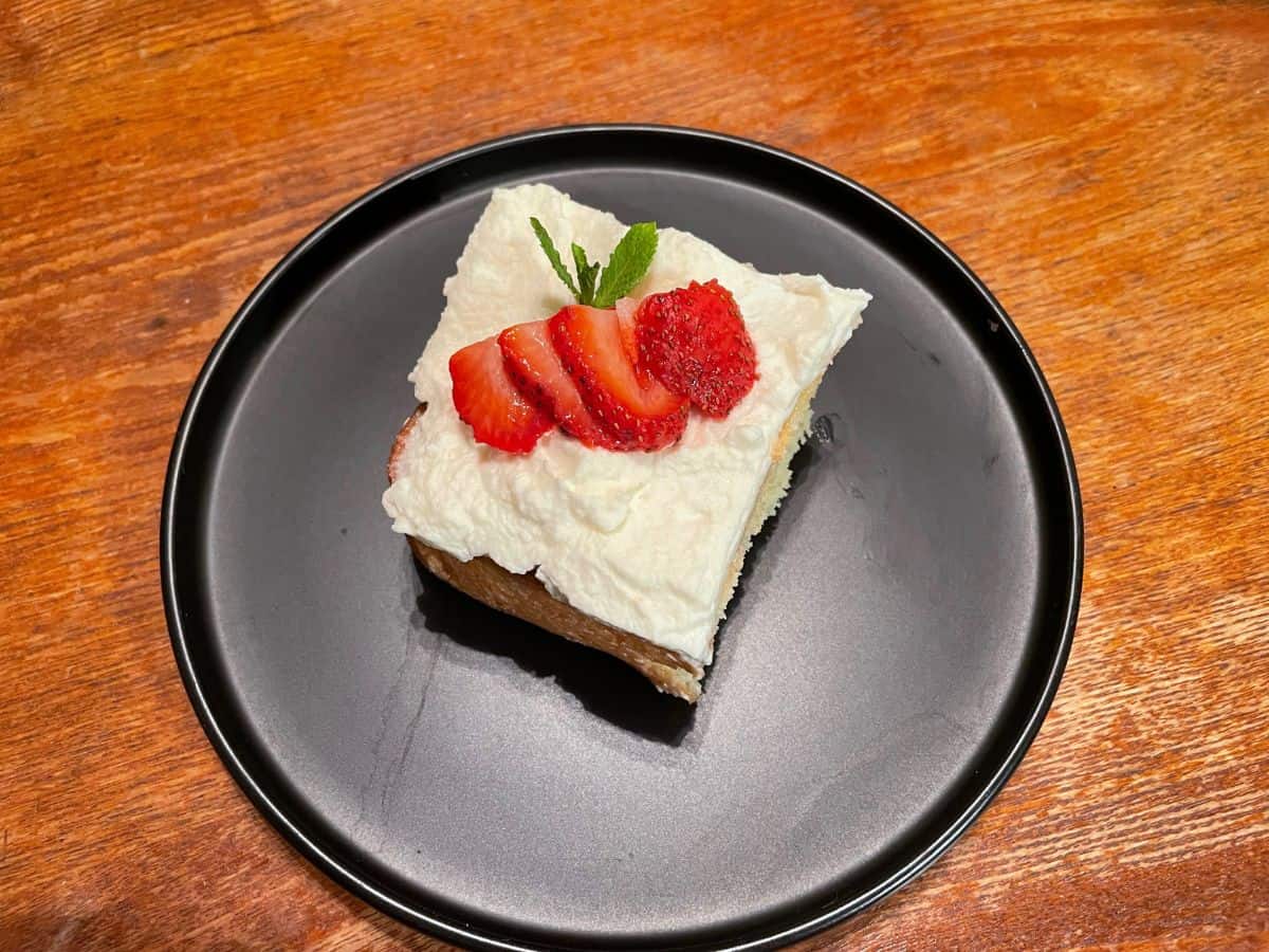 overhead shot of plated slice of tres leches cake