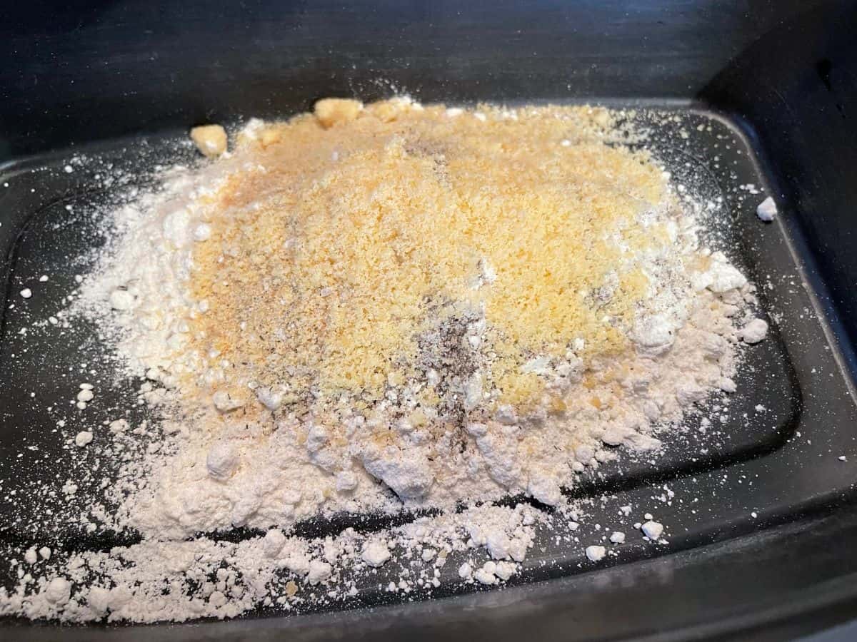 seasoned flour ingredients in a shallow black bowl