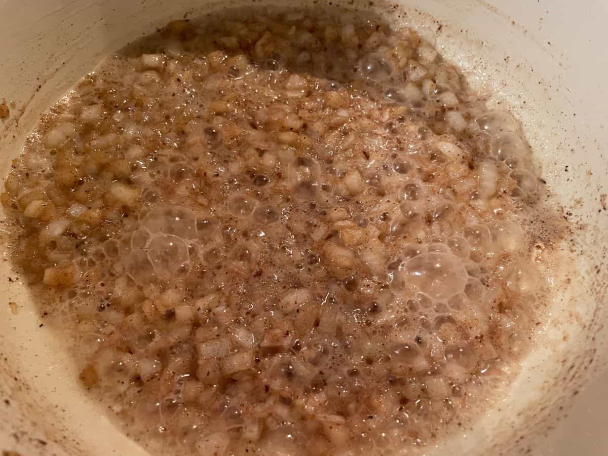 onions cooking in a roux in dutch oven