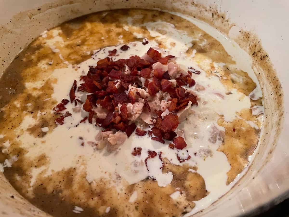 heavy cream, chopped clams, and bacon add to clam broth mixture.