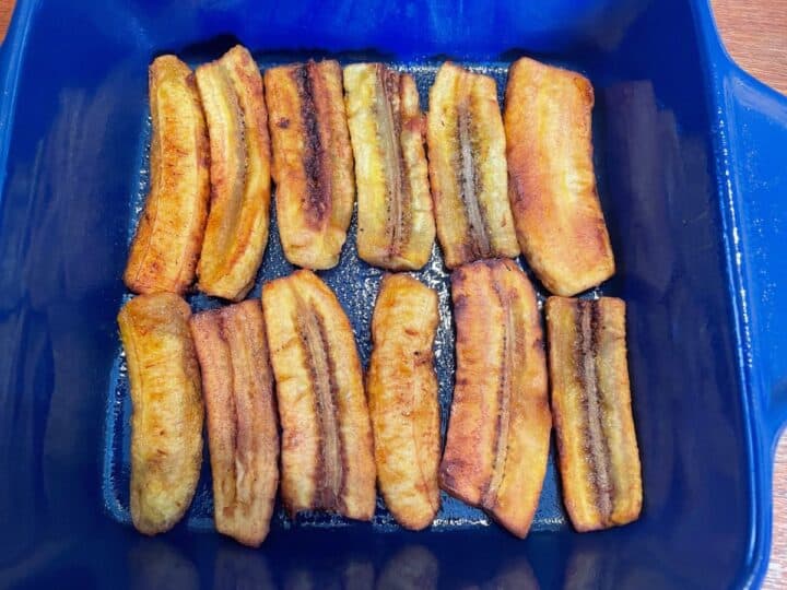 layer of sliced sweet plantains at the bottom of a baking dish